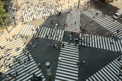 High angle view of people walking in city