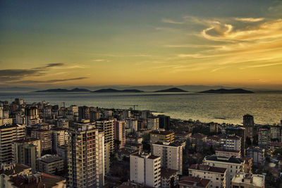 High angle shot of cityscape at sunset