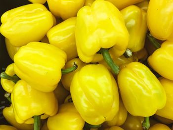 Full frame shot of yellow bell peppers for sale in market