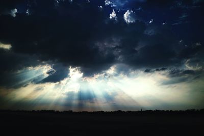 Scenic view of landscape against cloudy sky