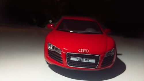 Close-up of car on road against white background