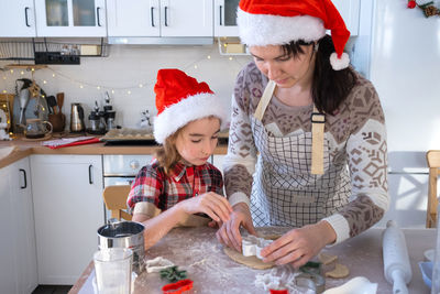 Portrait of siblings in kitchen