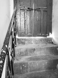 High angle view of old staircase against wall