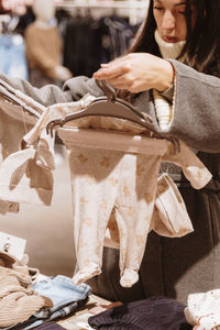 Midsection of woman using mobile phone