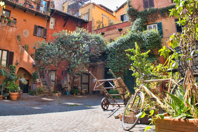 Bicycle on street amidst buildings in city