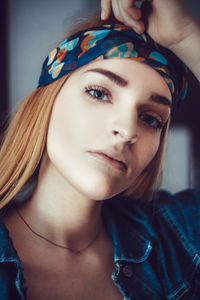 Close-up portrait of woman at home