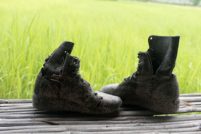 Close-up of black shoes on ground
