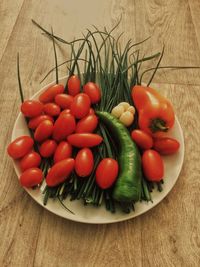 High angle view of tomatoes in plate on table