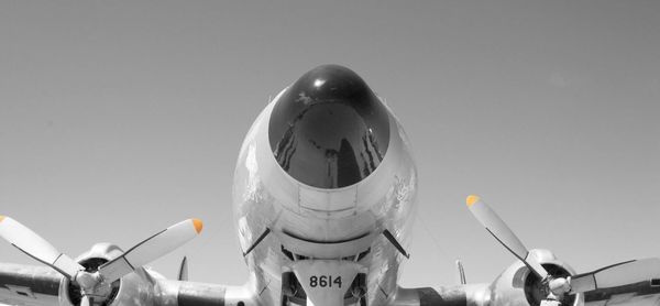 Low angle view of airplane against sky at night