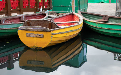 Boats moored in lake