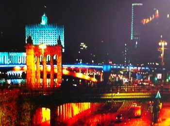 Illuminated buildings in city at night