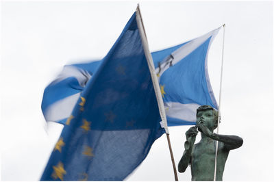 Statue against blue sky
