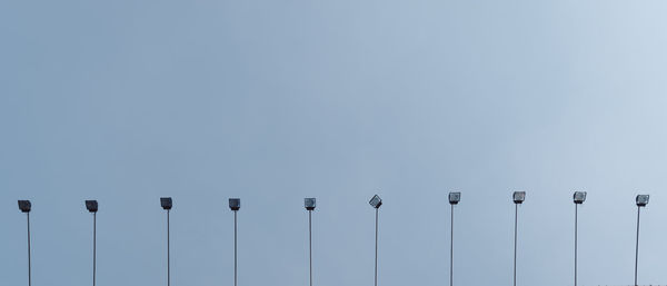 Low angle view of birds against clear sky