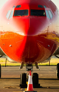 Close-up of airplane at airport runway