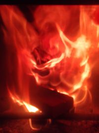 Close-up of fire burning at night