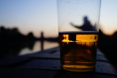 Close-up of beer glass on table