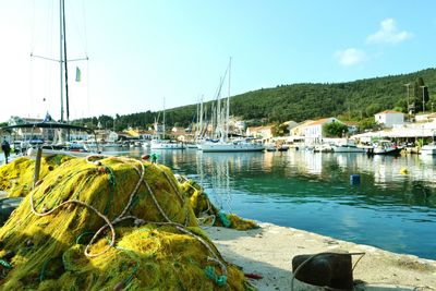 Boats moored at harbor