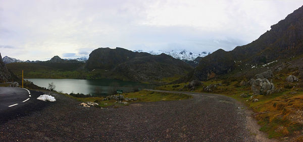 Scenic view of lake and mountains against sky