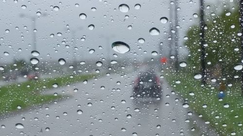 Close-up of raindrops on glass window