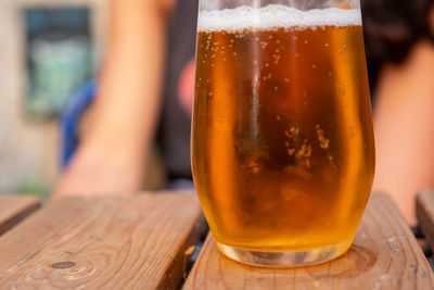 Close-up of beer glass on table