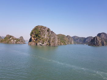 Scenic view of sea against clear blue sky