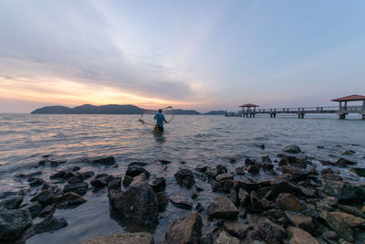 Scenic view of sea against sky during sunset