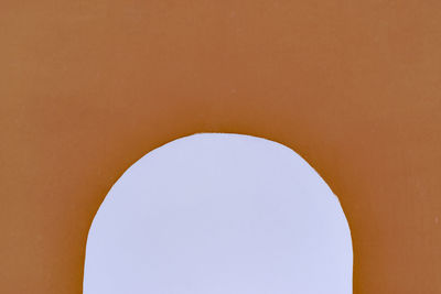 Low angle view of sky seen through hole