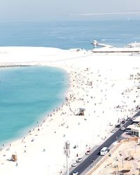 High angle view of people on beach against sky