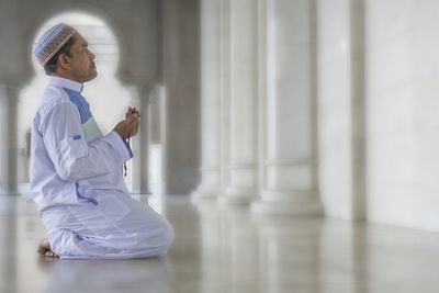 Man praying in mosque