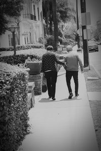 Rear view of couple walking outdoors