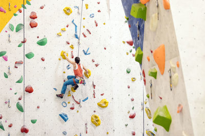 Woman climbing on wall