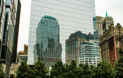 Low angle view of modern buildings against sky