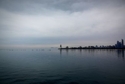 Scenic view of sea against cloudy sky