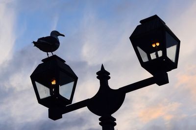 Low angle view of weather vane