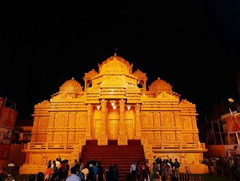 Group of people in temple at night