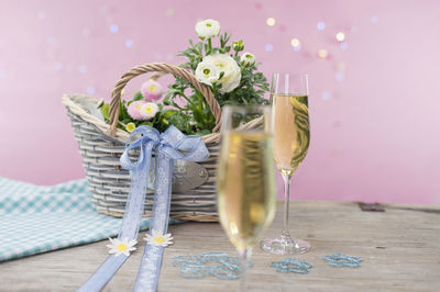 Close-up of white wine glass on table