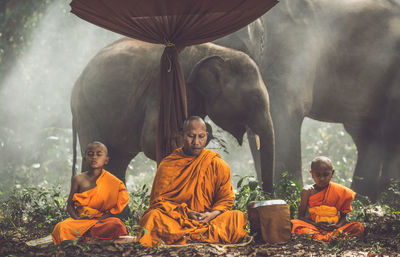 Group of people sitting in temple