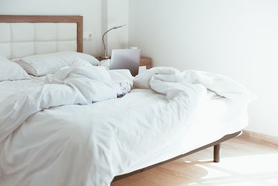 White blanket on bed at home