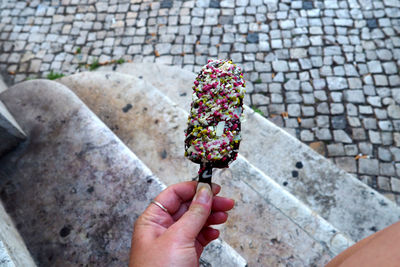 Close-up of hand holding ice cream