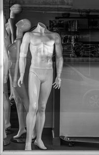 Midsection of woman wearing mask at store