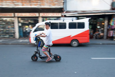 Man riding bicycle on street