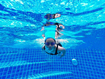 Portrait of girl swimming in pool