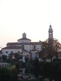 View of buildings in city against clear sky