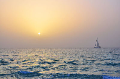 Scenic view of sea against sky at sunset