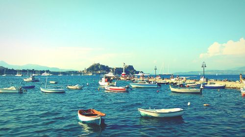 Boats moored in sea