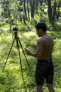 Guy with tablet making video blog on phone. isolated person giving online classes. 