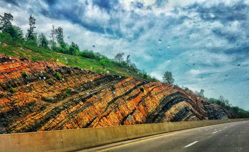 Road against cloudy sky