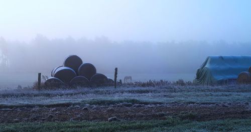 Scenic view of field against sky during winter