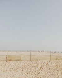 Scenic view of beach against clear sky