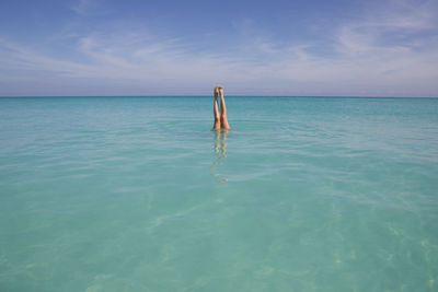 Person swimming in sea
